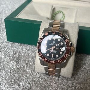 Rolex GMT-Master II with Black and Gold Bezel